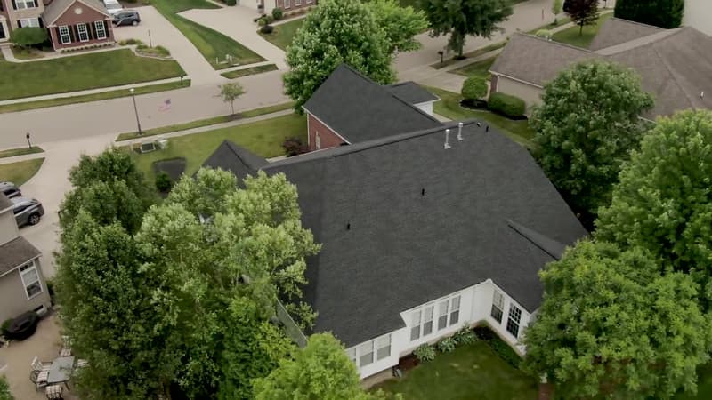 Aerial view of dark shingle roof on single-story home