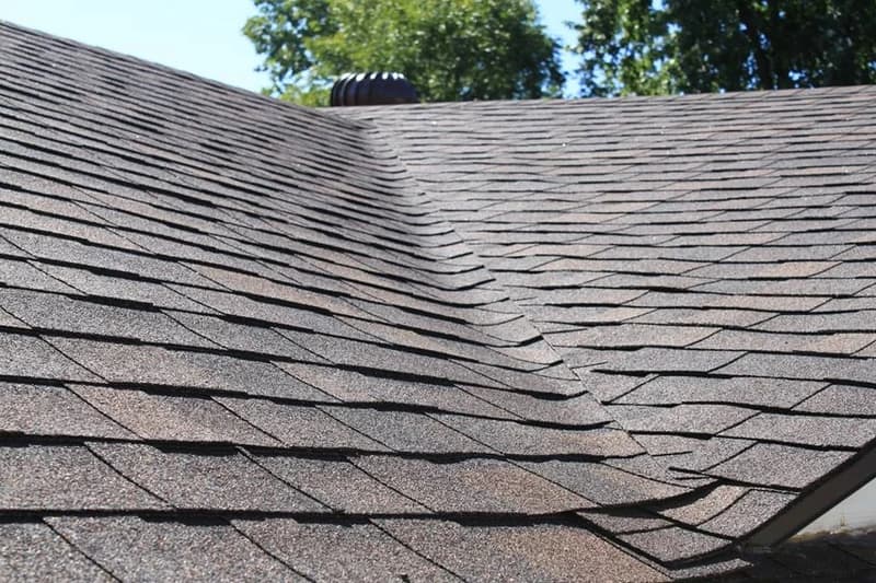 Close view of asphalt shingles at roof valley